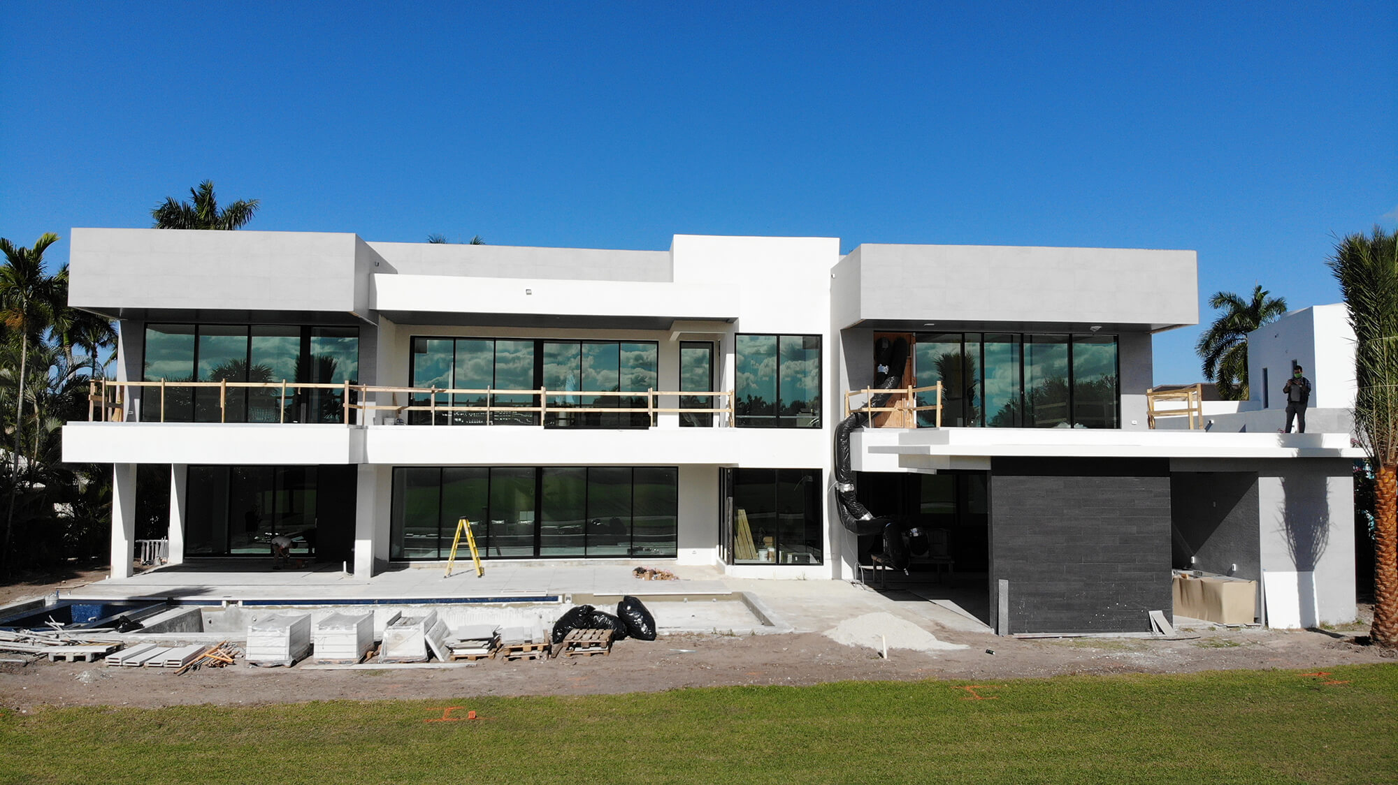 Facade of two-story modern home that is under construction